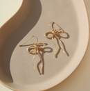 Boucles d'oreilles Token Coquette avec nœud